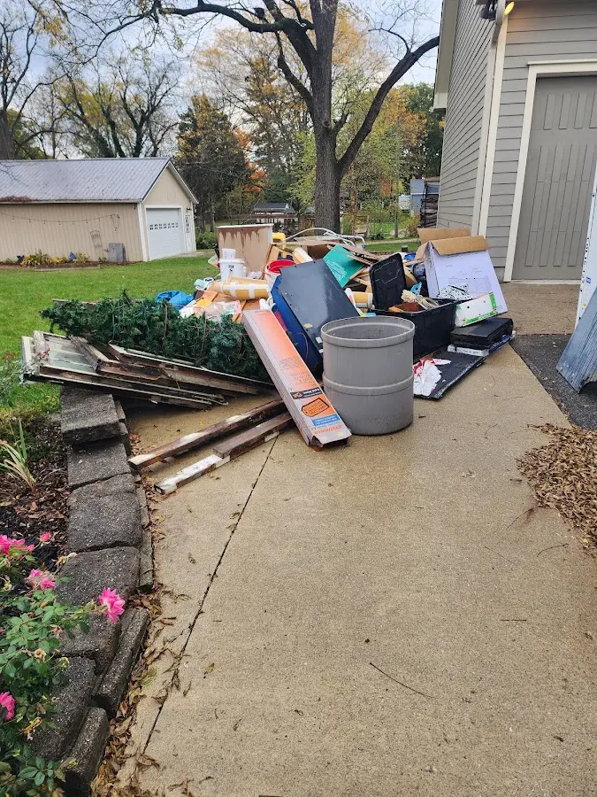 Dumpster being loaded with debris for Residential Dumpster Rental in North Fair Oaks